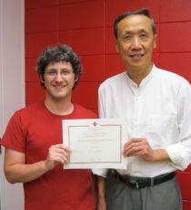 Jared Guilbeau with Keng Deng presenting his certificate