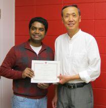 Vinodh Chellamuthu with Keng Deng receiving his certificate