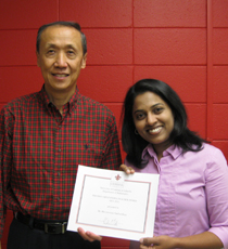 Bhuvaneswari Sambandham with Keng Deng presenting her certificate
